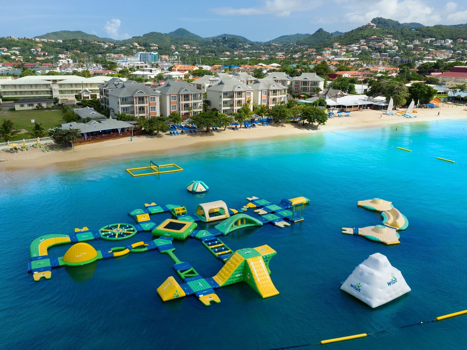 Bay Gardens Beach Resort and Spa St. Lucia beachfront hotel on Reduit Beach with pools, family-friendly amenities, and Caribbean charm.