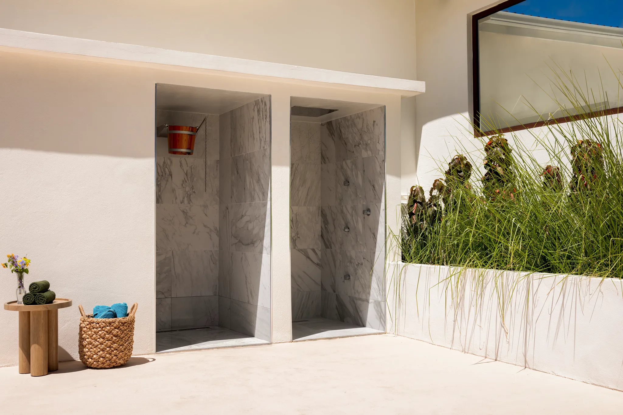 Outdoor spa bucket shower at Secrets St. Lucia Resort & Spa, designed for a refreshing hydrotherapy experience in a tropical setting.