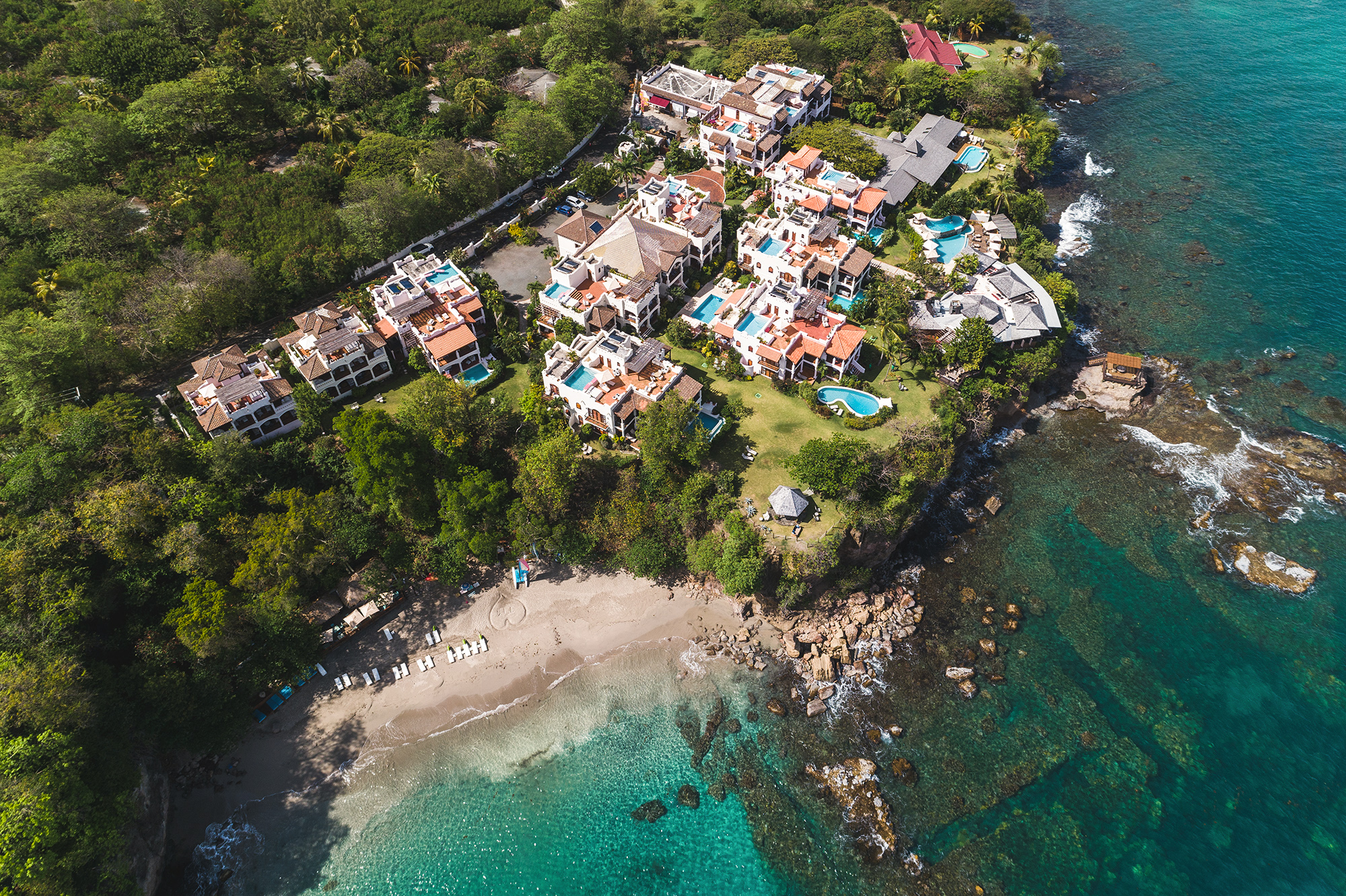 Cap Maison Resort and Spa boutique luxury hotel in St. Lucia with cliffside villas, private plunge pools, and intimate Caribbean elegance.