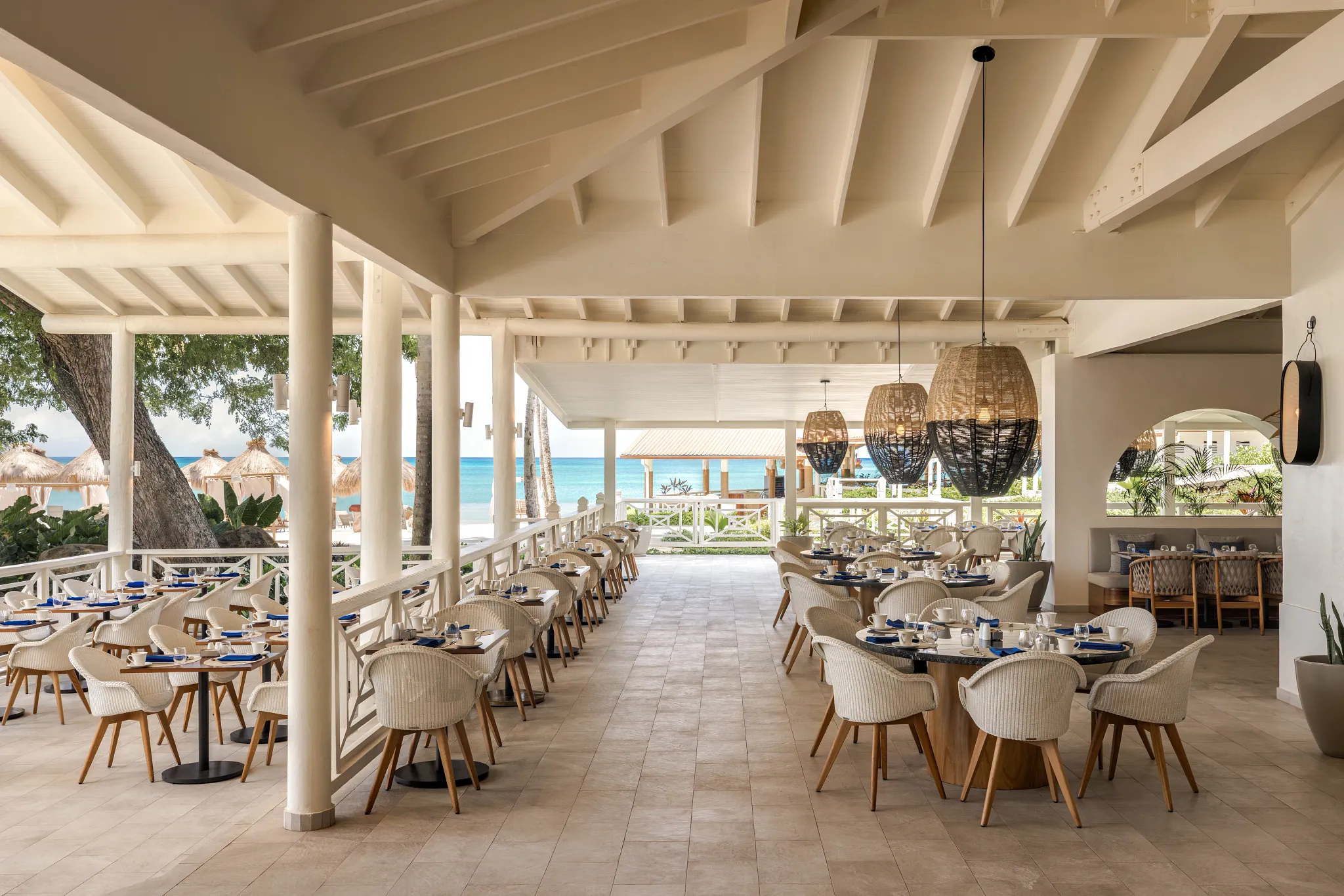 Market Café at Secrets St. Lucia Resort & Spa featuring an open-air buffet restaurant with tropical garden views and a variety of international dishes.
