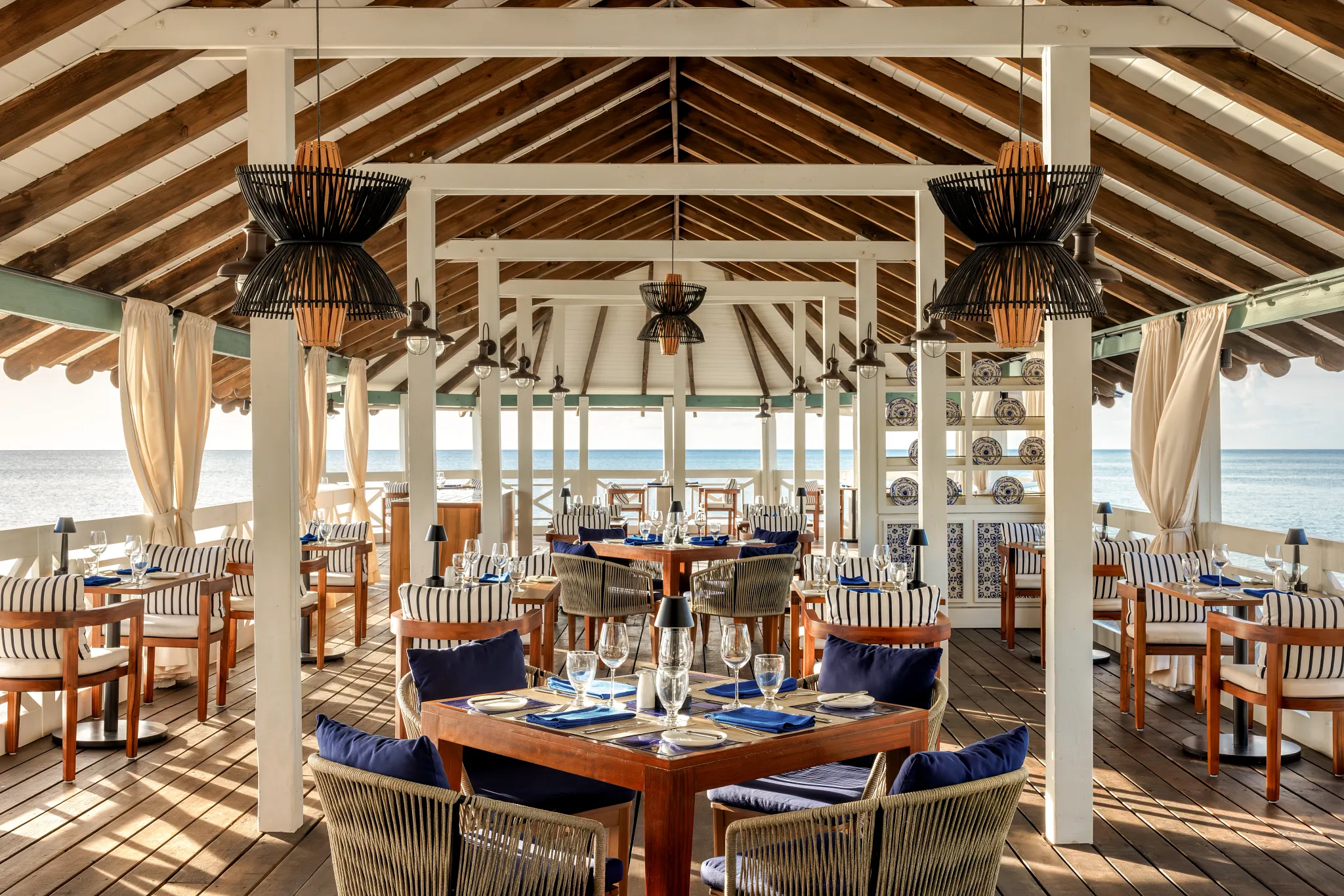 Morgan’s Pier restaurant at Secrets St. Lucia Resort & Spa featuring rustic seaside dining with ocean views and French-inspired cuisine.