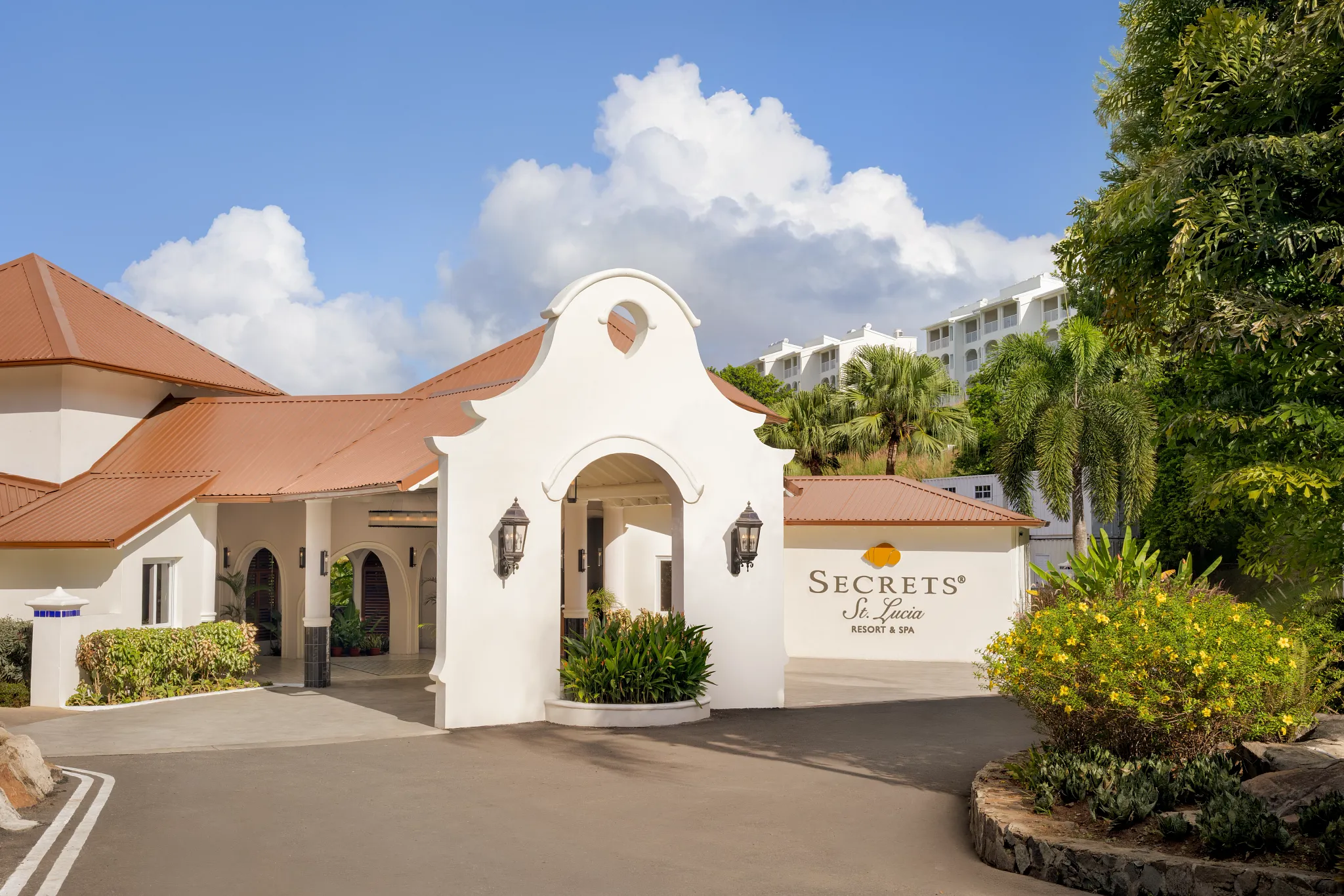 Entrance driveway and welcome arch at Secrets St. Lucia Resort & Spa.