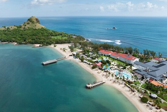 Sandals Grande St. Lucian couples-only all-inclusive resort on Pigeon Island Causeway with overwater bungalows and turquoise waters.